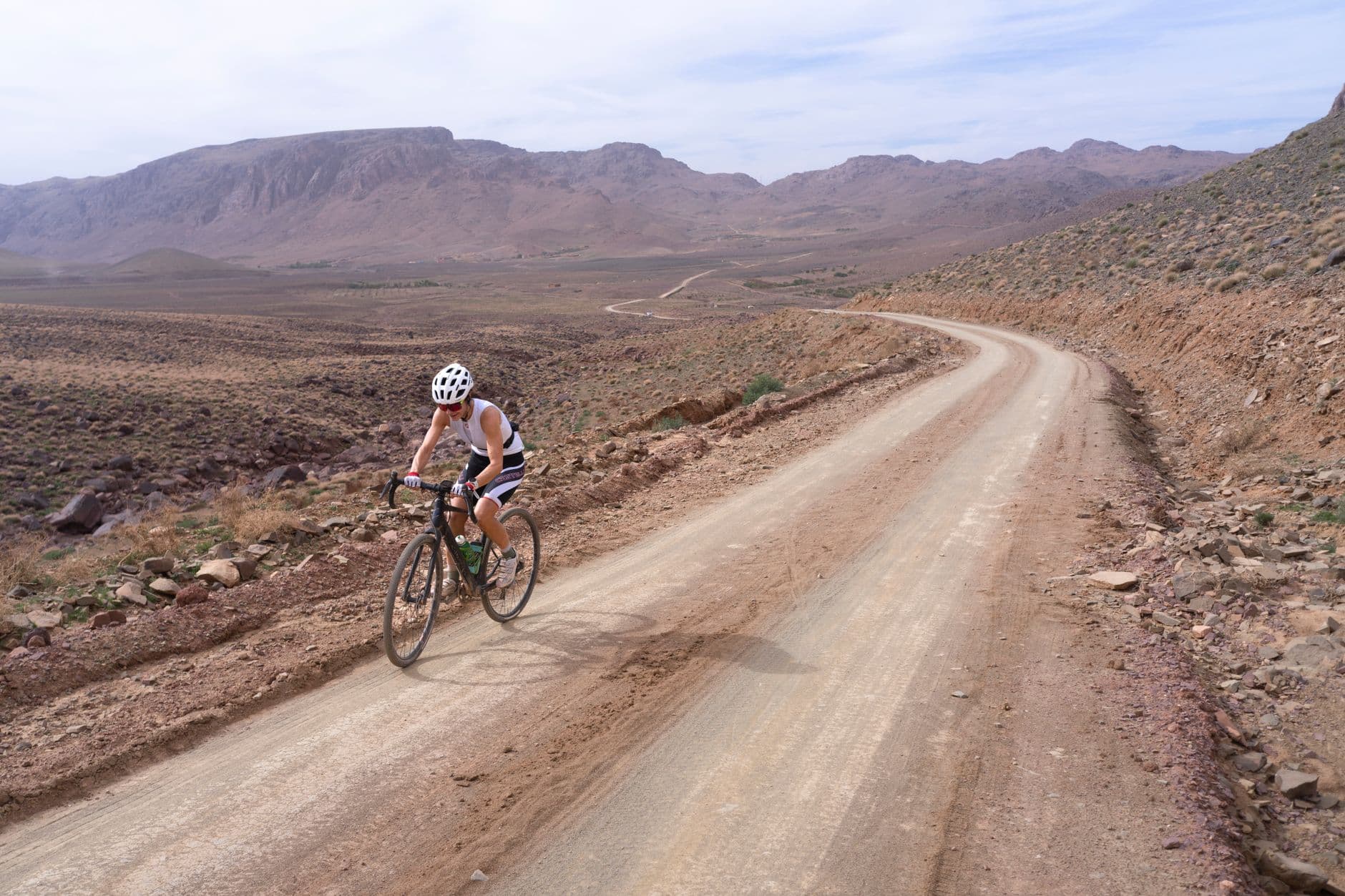 A cyclist on a rocky desert trail
