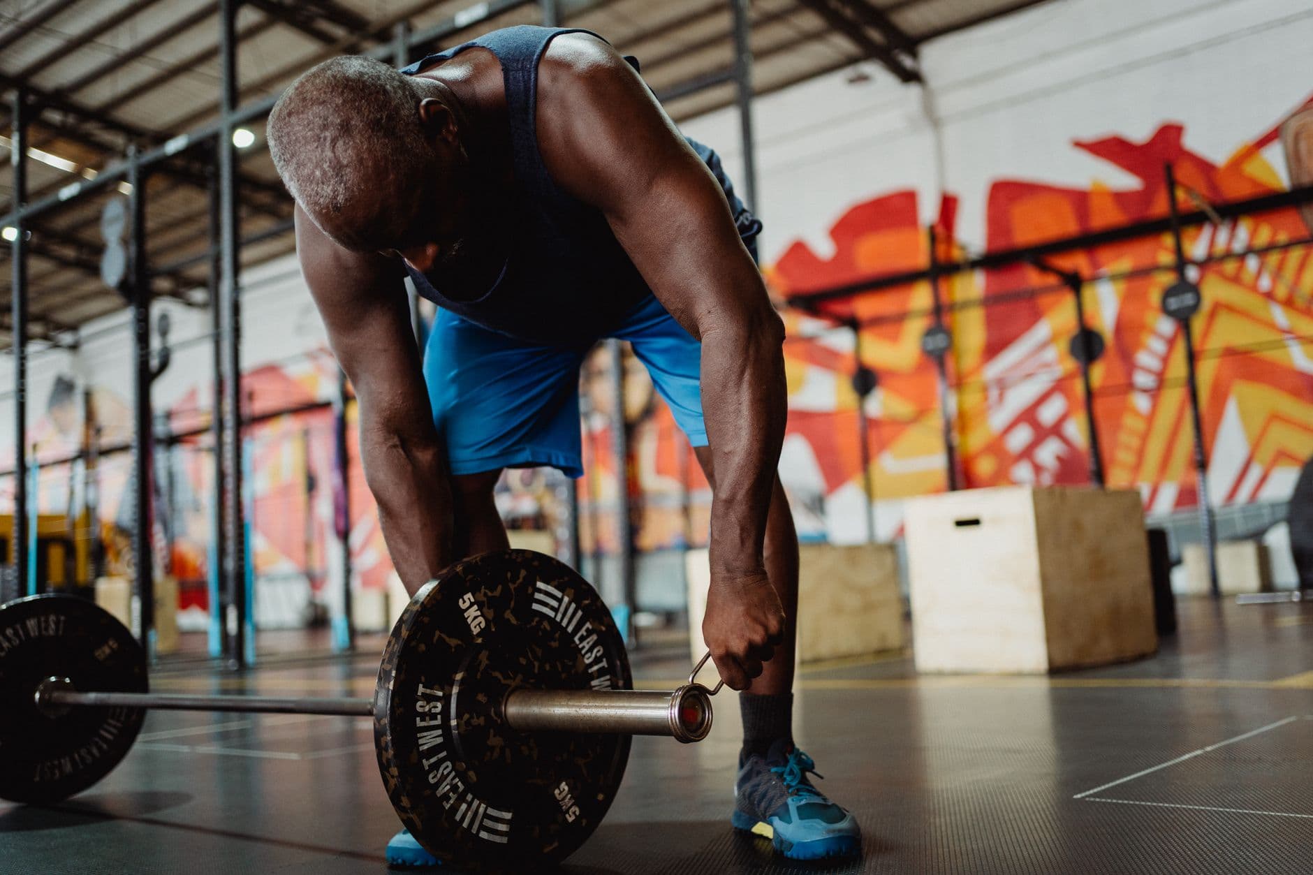A barbell row in a gym