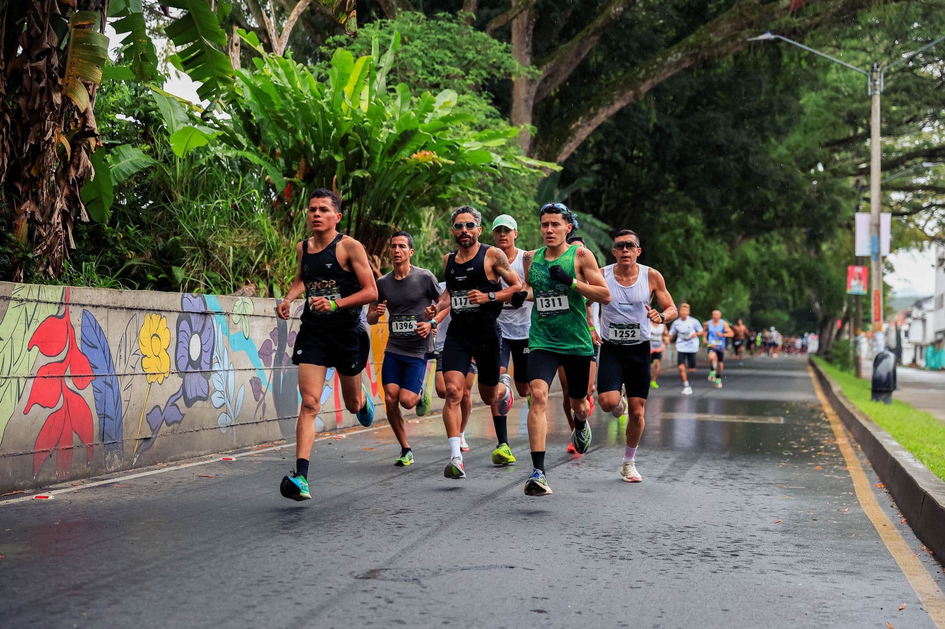 A pack of runners on a city road during a race